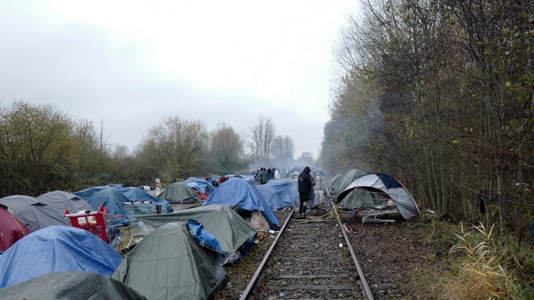 A migrants makeshift camp is set up in Calais, northern...