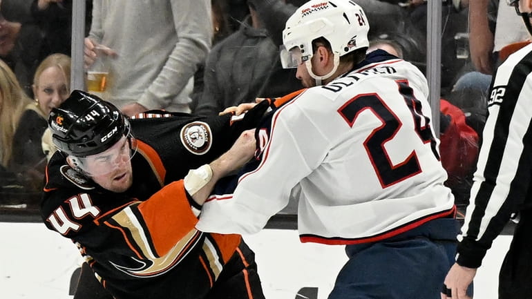 Anaheim Ducks left wing Ross Johnston (44) fights with Columbus...
