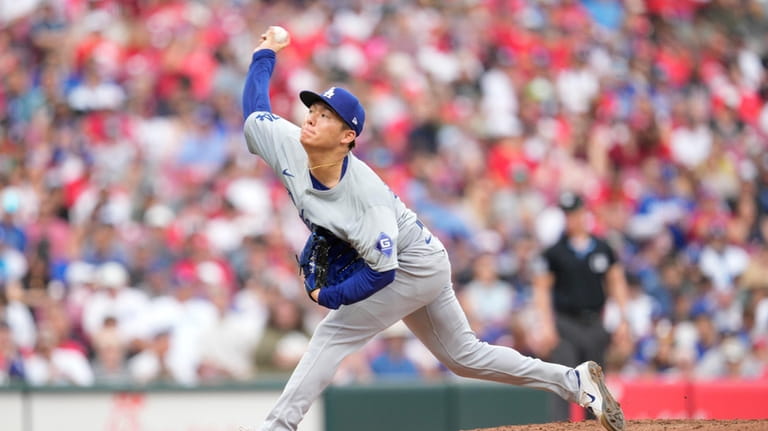 Los Angeles Dodgers pitcher Yoshinobu Yamamoto throws during the second...