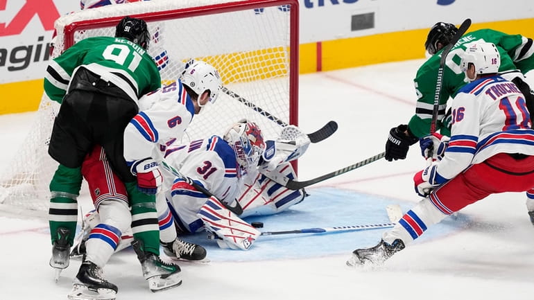 Stars center Tyler Seguin takes a shot and scores as...