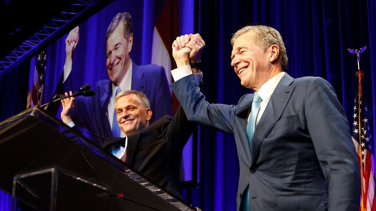 North Carolina Governor Roy Cooper right, introduces Democratic North Carolina...