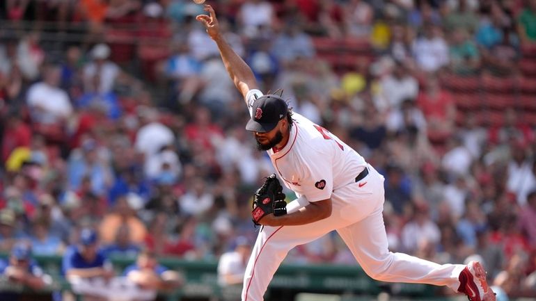 Boston Red Sox pitcher Kenley Jansen delivers a pitch to...