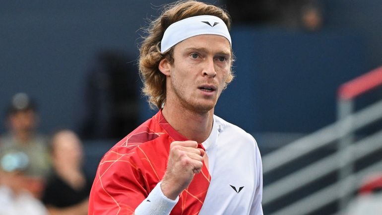 Andrey Rublev, of Russia, reacts to a shot to Matteo...