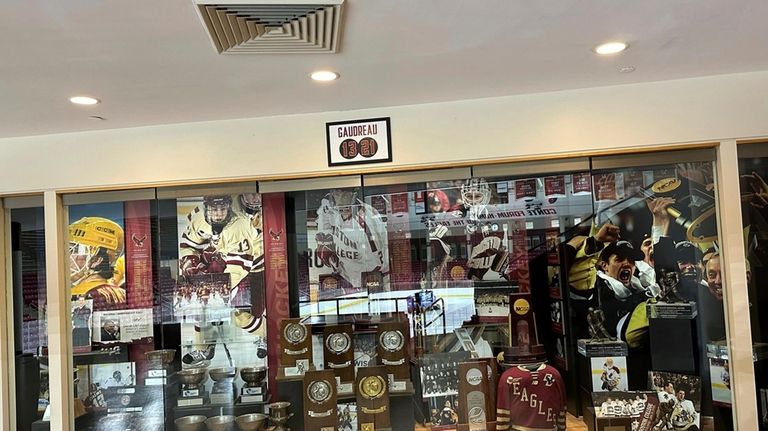 A sign hangs above the trophy case at Boston College's...