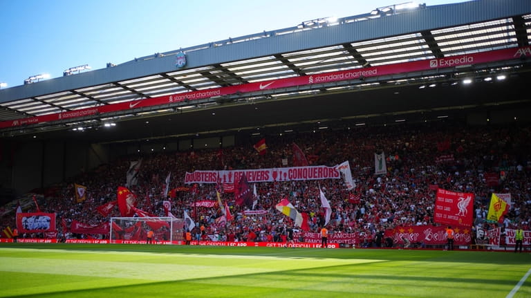 Fans greet Liverpool's manager Jurgen Klopp ahead the English Premier...