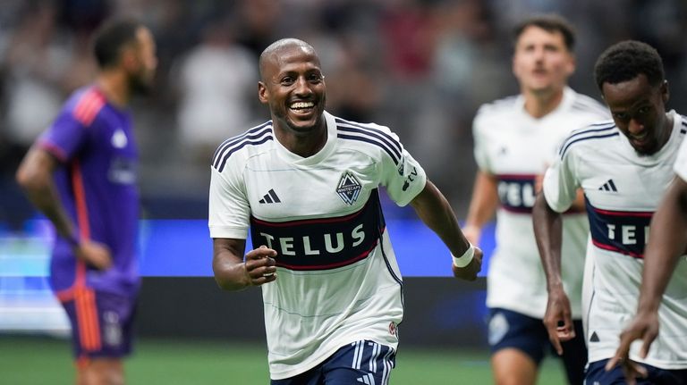 Vancouver Whitecaps' Fafa Picault (11) celebrates his goal against the...