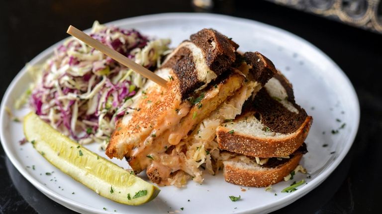 The vegan Reuben sandwich made with marinated and grilled tempeh...