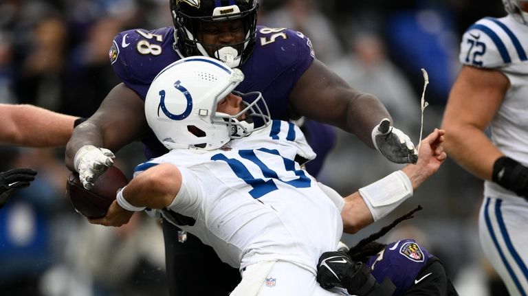 Indianapolis Colts quarterback Gardner Minshew (10) is hit in the...