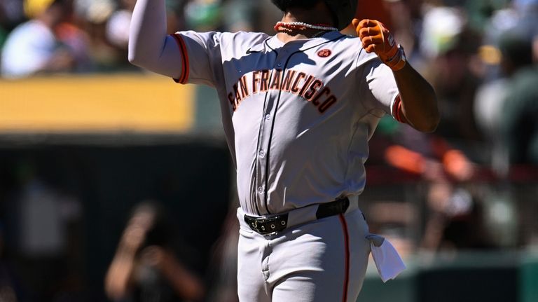 San Francisco Giants' Jerar Encarnacion celebrates after his two-run home...