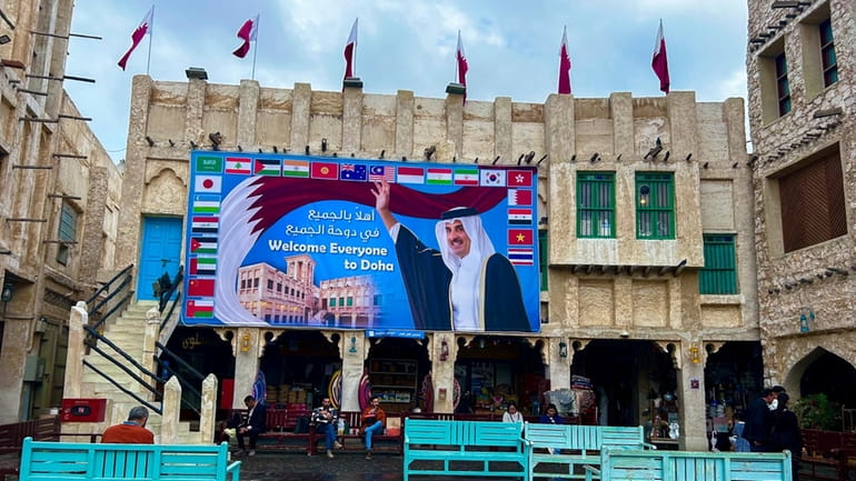 A billboard with a photograph of Qatar's Amir Sheikh Tamim...