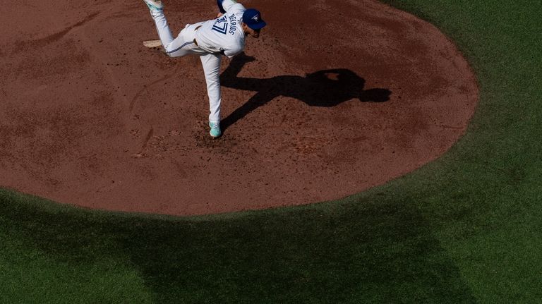 José Berríos of the Toronto Blue Jays throws a pitch...