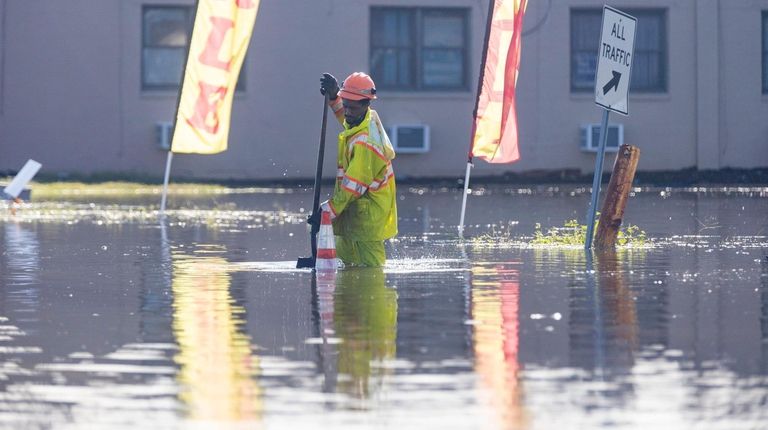 Port Jefferson is heavily flooded as the the remnants of...