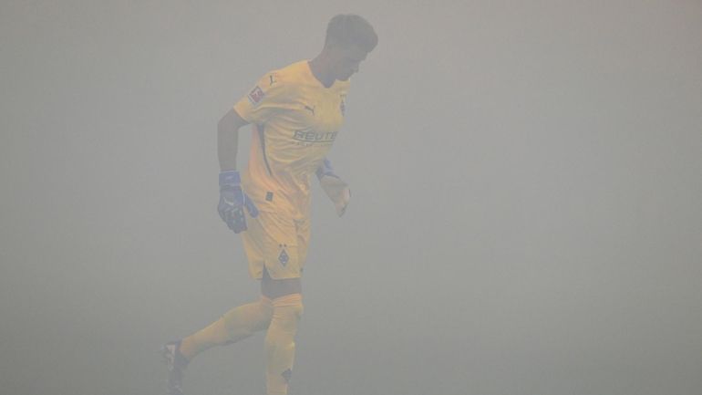 Gladback goalkeeper Jonas Omlin walks on the pitch during a...