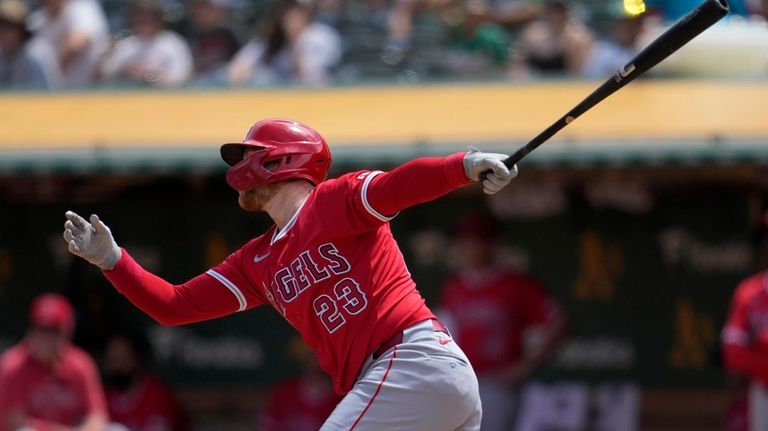 Los Angeles Angels' Brandon Drury watches his sacrifice fly that...