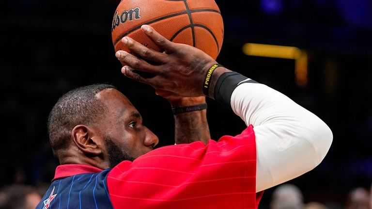 Los Angeles Lakers forward LeBron James (23) warms up before...