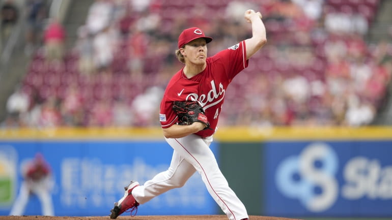 Cincinnati Reds' Stuart Fairchild (17) celebrates with first base