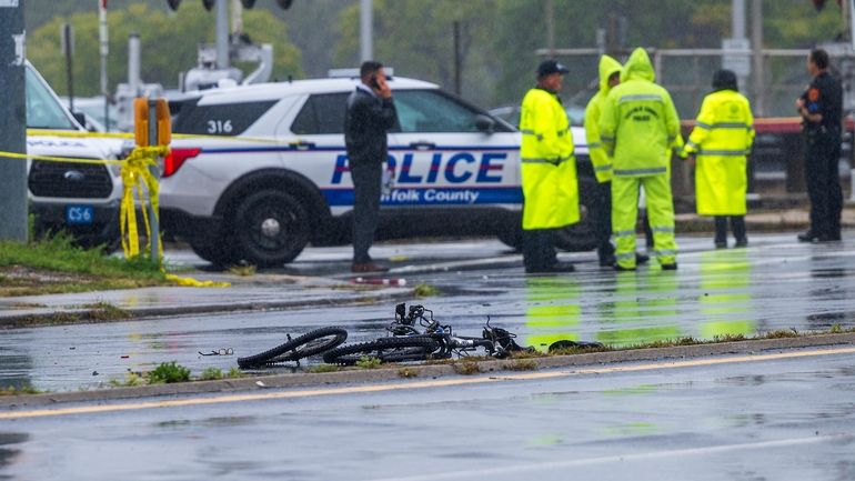 Suffolk police investigate the scene of a crash involving a bicyclist and...