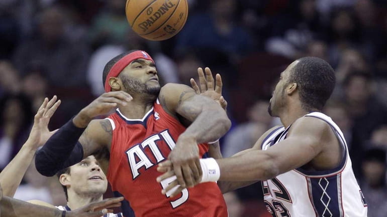 Atlanta Hawks' Josh Smith (5) competes for the ball against...