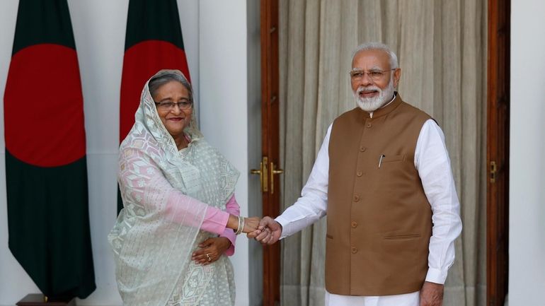 FILE- Indian Prime Minister Narendra Modi shakes hand with his...