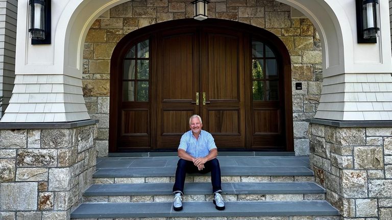 Jason Giessel in front of the Upper Brookville home he...