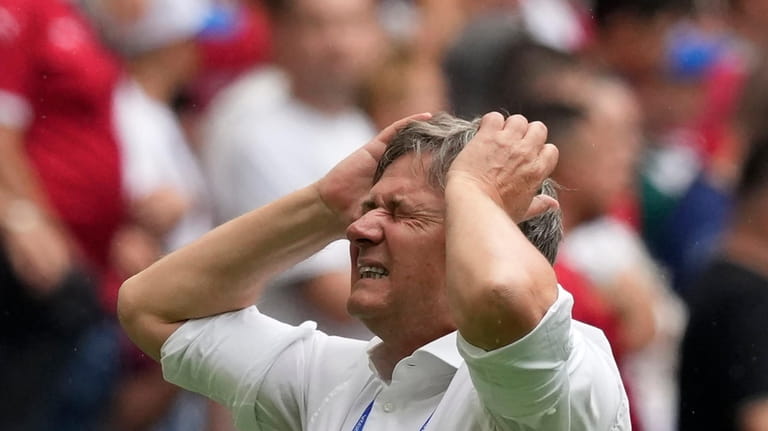 Serbia's head coach Dragan Stojkovic reacts after a missed chance...
