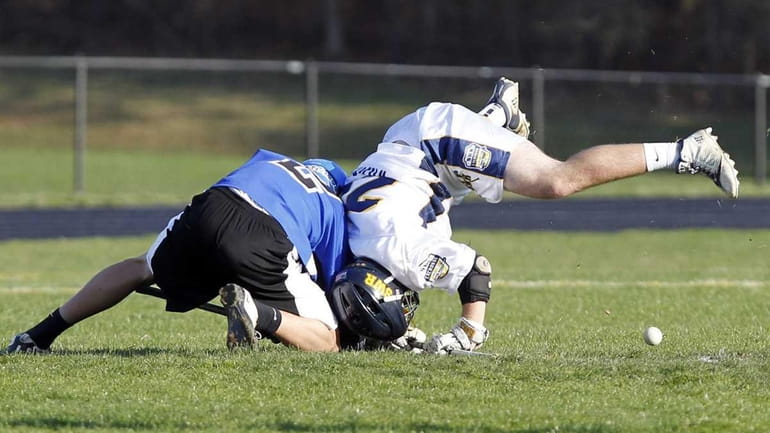SWR's MIke Loscalzo (24) wins the face-off against Hauppauge's Justin...