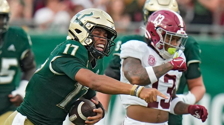 South Florida quarterback Byrum Brown (17) celebrates after making a...