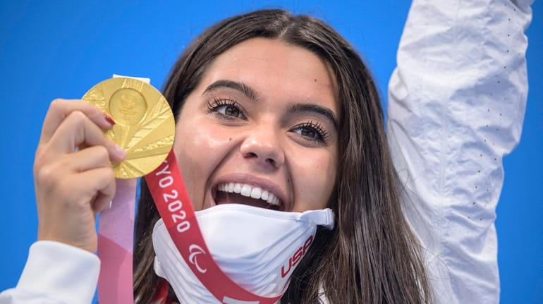 Anastasia Pagonis of the U.S. displays her gold medal for...