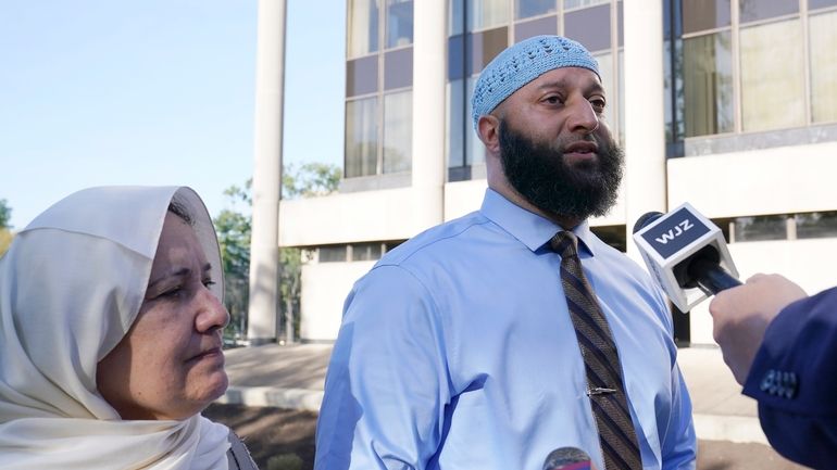 Adnan Syed and his mother Shamim Rahman talk with reporters...