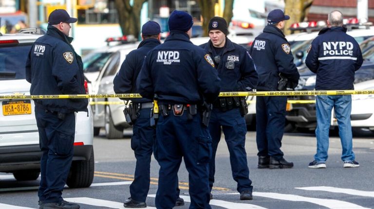 New York police stand outside the 41st Precinct at the...