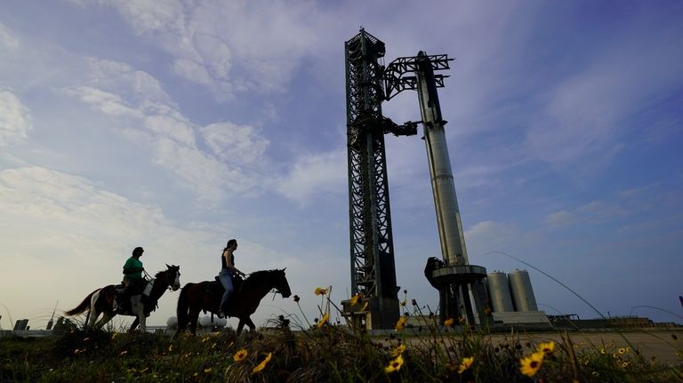 NASA astronaut Sunita Williams, left, and Haley Esparza ride on...