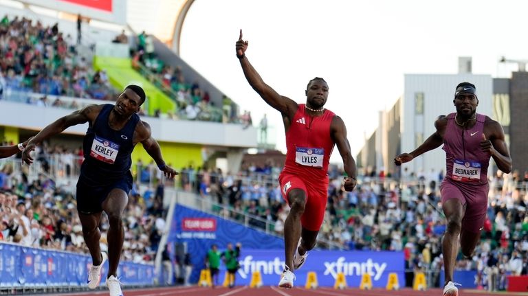 Noah Lyles celebrates after winning the men's 100-meter final during...