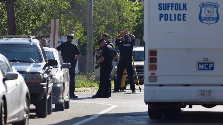 Suffolk County police at the scene of a fatal shooting...