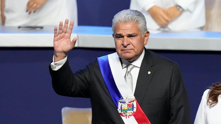 New Panamanian President Jose Raul Mulino waves before giving a...
