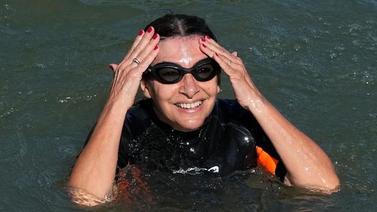 Paris Mayor Anne Hidalgo swims in the Seine river Wednesday,...