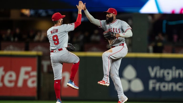 Los Angeles Angels' Zach Neto, left, and Jo Adell celebrate...