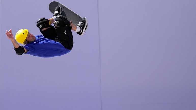 Britain's Andrew Macdonald, a 51-year-old dad, competes in the men's skateboarding...