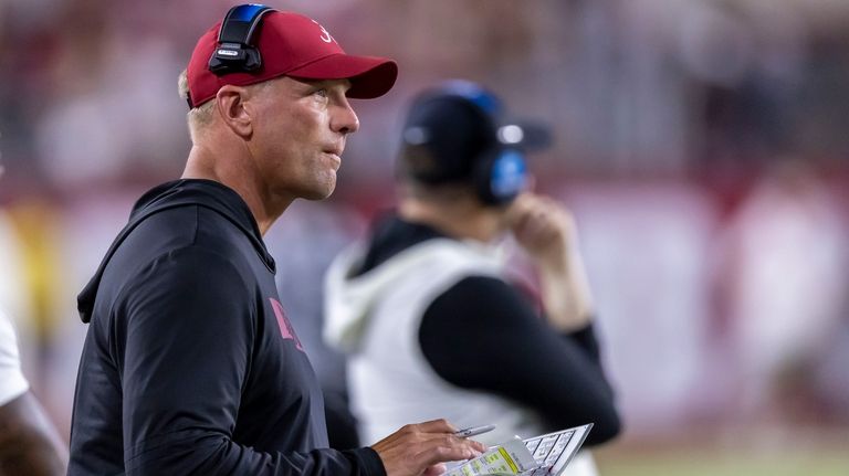 Alabama head coach Kalen DeBoer looks on in a timeout...