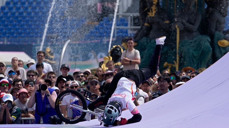 Sun Jiaqi, of China, crashes on a ramp during the...