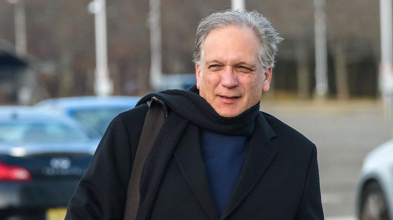 Edward Mangano arrives at federal court in Central Islip on...