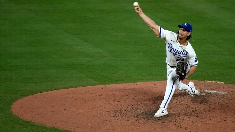 Kansas City Royals starting pitcher Michael Lorenzen throws during the...