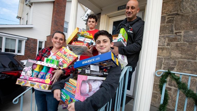 Shannan and Nick Pearsall with their sons, Aidan, 14, in...