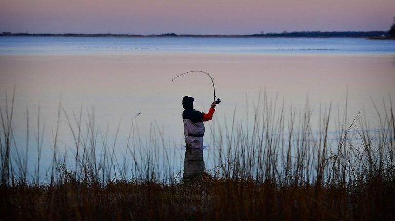 Joe Giordano of St. James fishes in the serene waters...