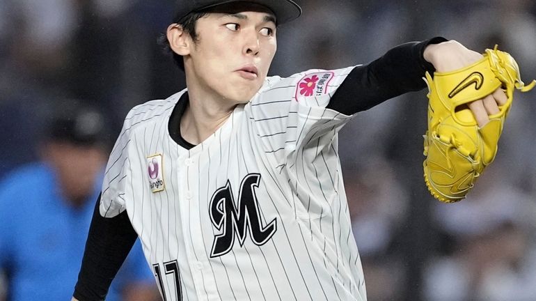 Chiba Lotte Marines pitcher Roki Sasaki throws against the Fukuoka...