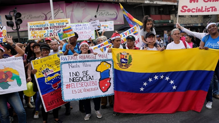 People attend the closing campaign on Venezuela Referendum on dispute...