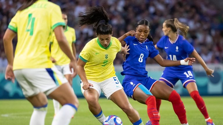 Brazil's Duda Sampaio vies for the ball with France's Grace...