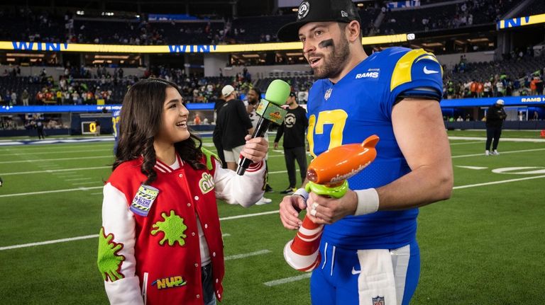 Los Angeles Rams quarterback Baker Mayfield (17) interviews after being...