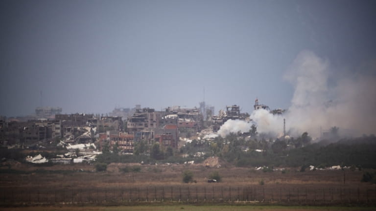 Smoke rises in the Gaza Strip as seen from southern...
