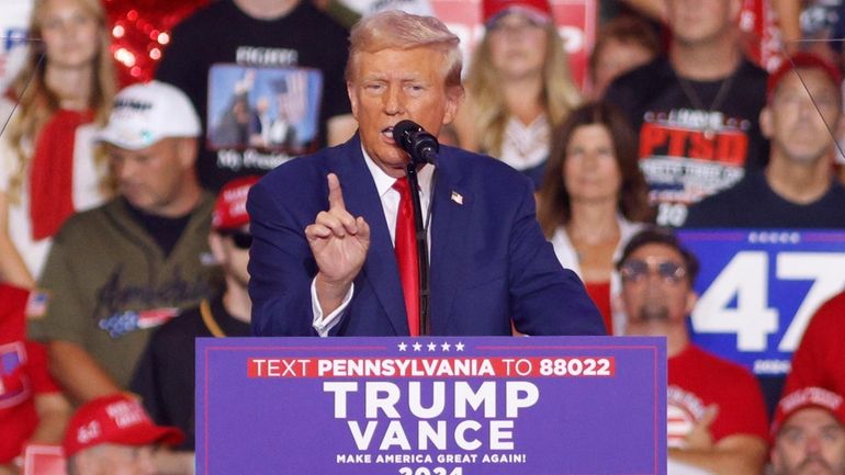 Republican presidential nominee former President Donald Trump speaks at a...