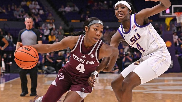 Texas A&M's Kay Kay Green (4) drives around LSU guard...